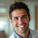 Portrait of Mark Rodriguez, a smiling Hispanic man with short hair.