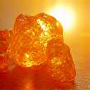 Vibrant citrine and carnelian crystals radiating warmth and energy, signifying vitality and focus, set against a bright, natural backdrop.