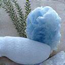 Dreamy setting with a sleeping mask, a natural linen pillow, and calming blue lace agate and celestite crystals, symbolizing deep sleep.